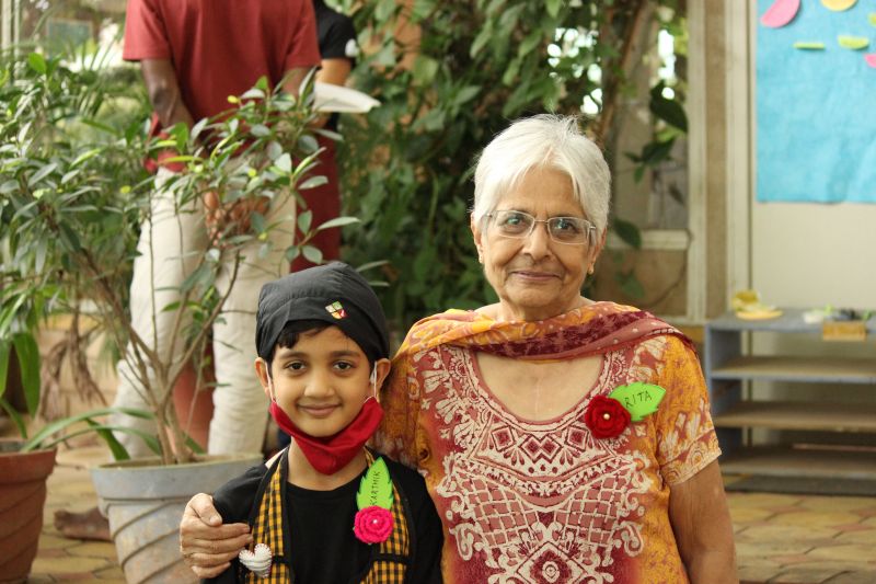 Youngest and oldest volunteer (79 and 9 yrs old) at Karma Kitchen